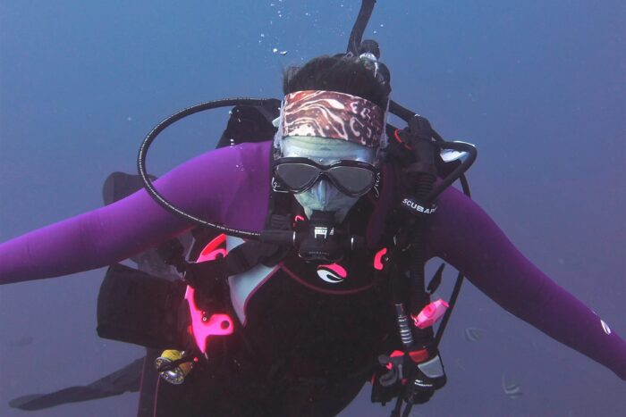 Diver with lionfish headband