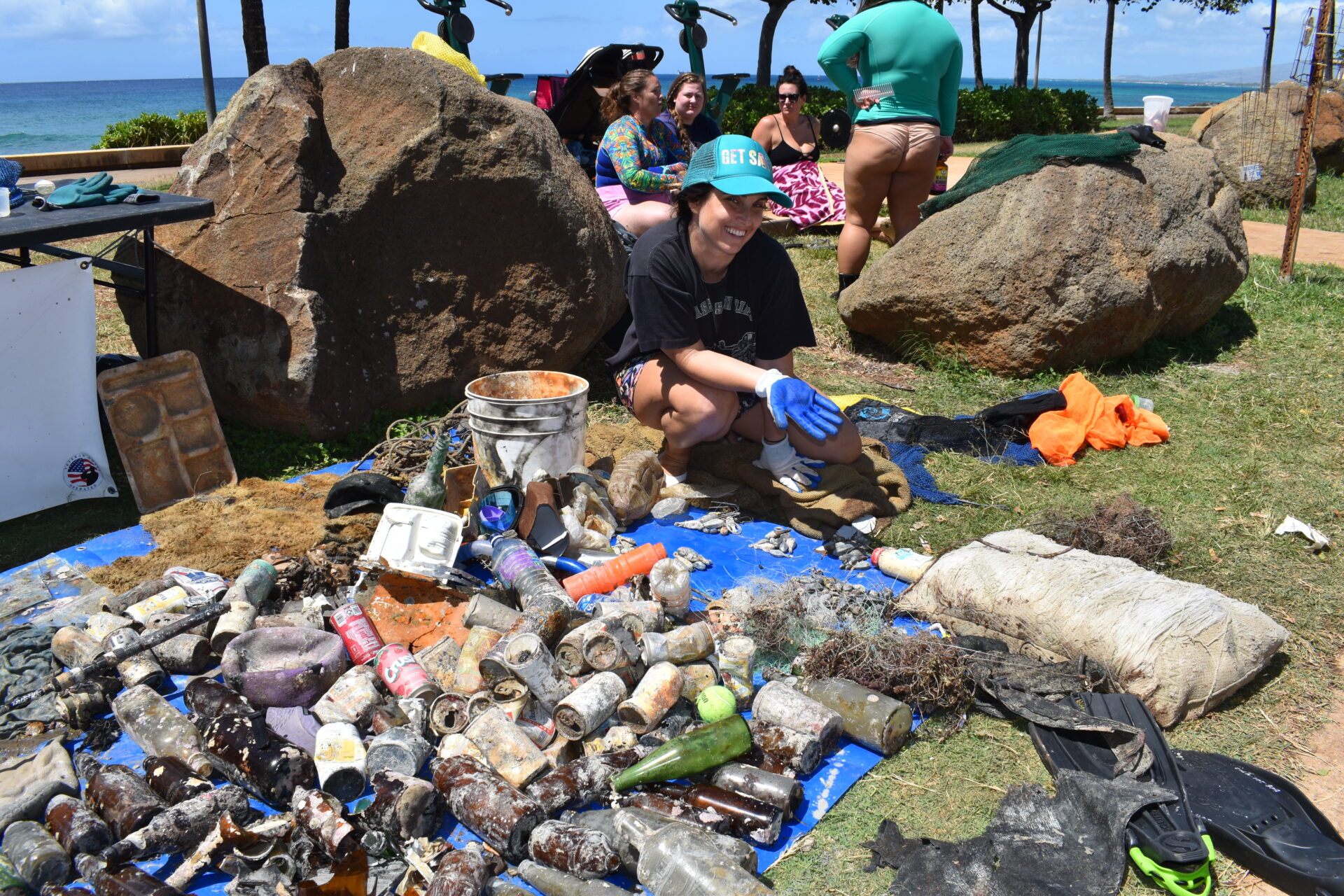 Volunteers at the Nudi Wear cleanup at Point Panic sorting through 402 pounds of trash that was removed from the ocean at the popular dive site on Oahu