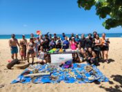 Volunteers at the Makaha Beach Cleanup dive