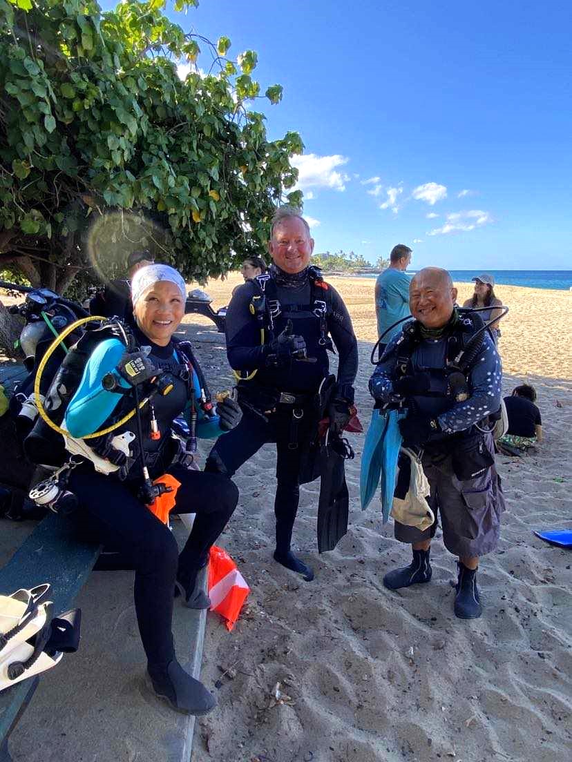 Cleanup volunteer divers at Makaha Beach Park