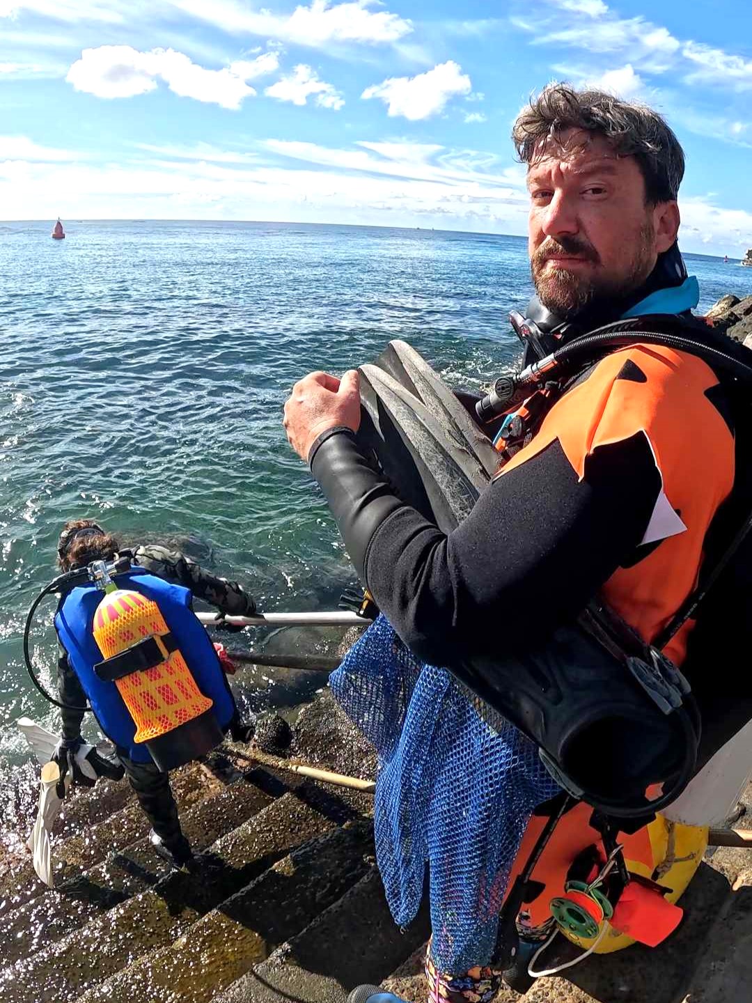 Costumed divers entering the water at Point Panic