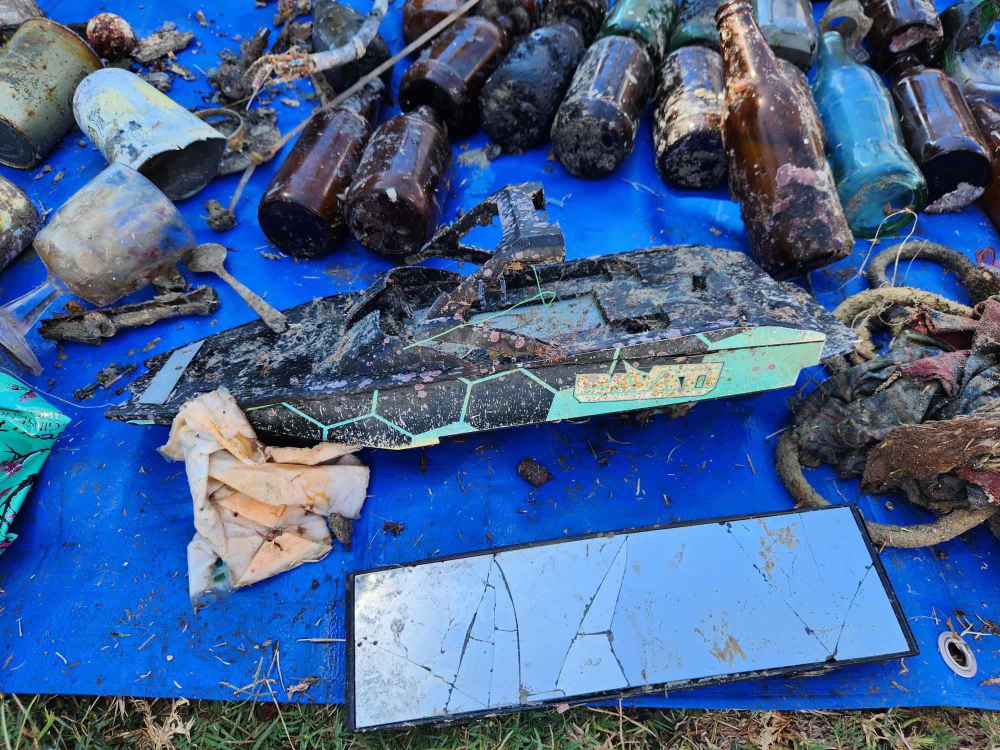 A toy boat and other debris found during the Halloween Dive