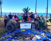 Nudi Wear volunteers with all the marine debris found during the Halloween Cleanup dive