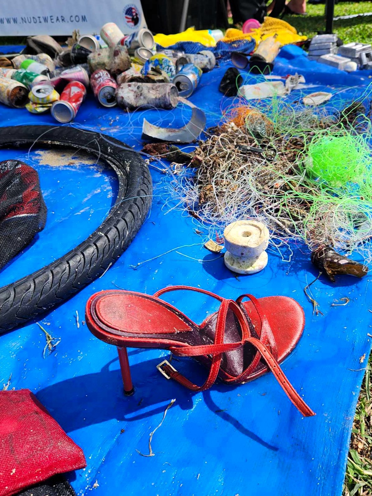 Red high heel removed by Nudi Wear from the ocean