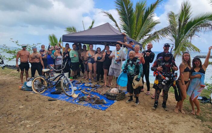 Nudi Wear and Aaron's Dive Shop volunteers at the Makai Research Pier Cleanup