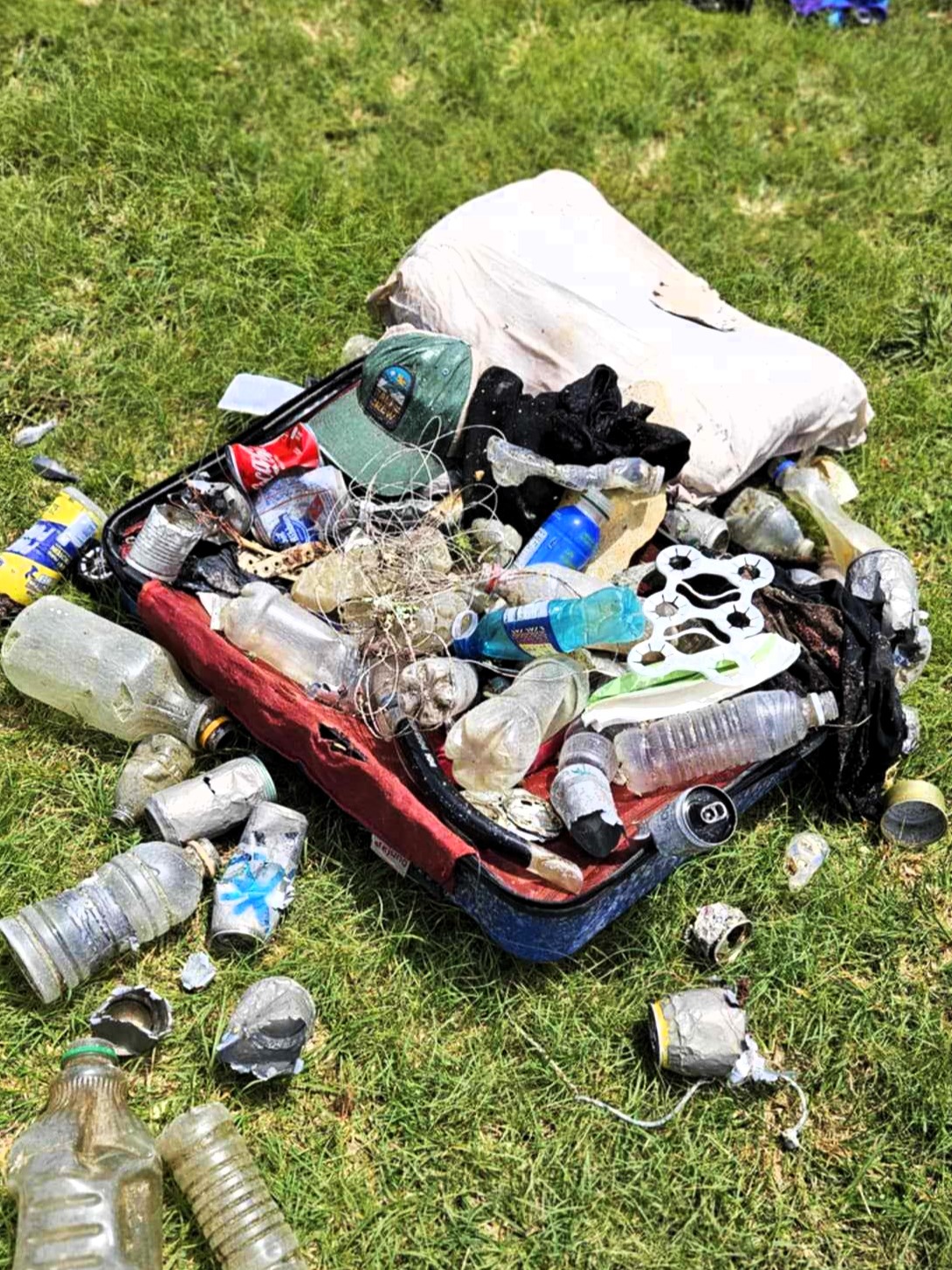 A suitcase and other trash pulled from the ocean during the cleanup
