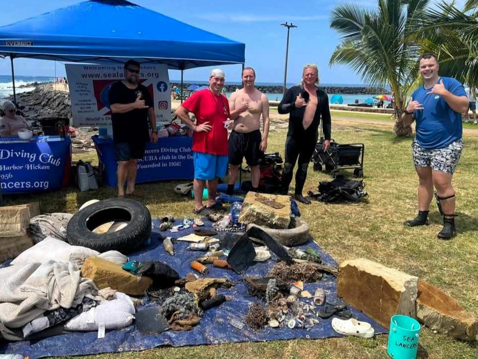 Sea Lancers with trash pulled out of the ocean during the cleanup