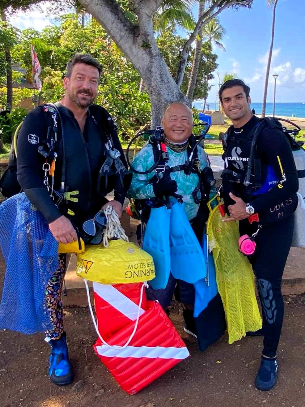 Nudi Wear volunteer divers ready for a cleanup dive
