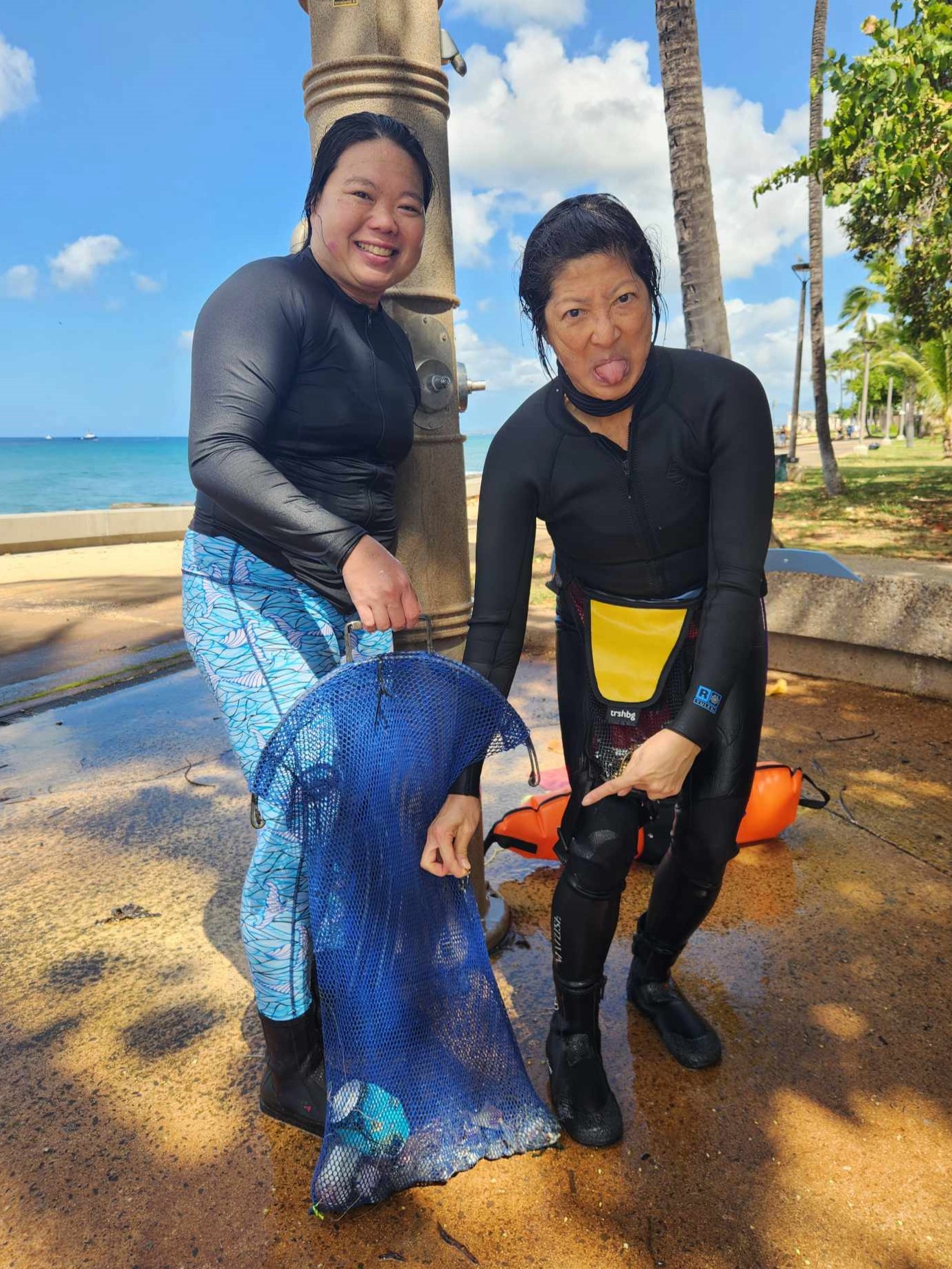 Freedivers showing off their haul of fishing line and lead weights
