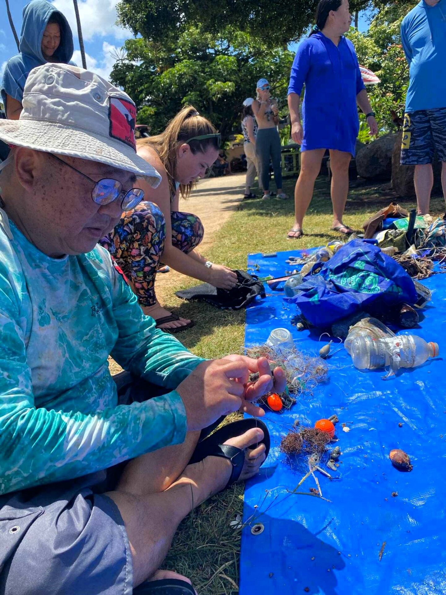 Volunteers sorting the trash pulled from the ocean
