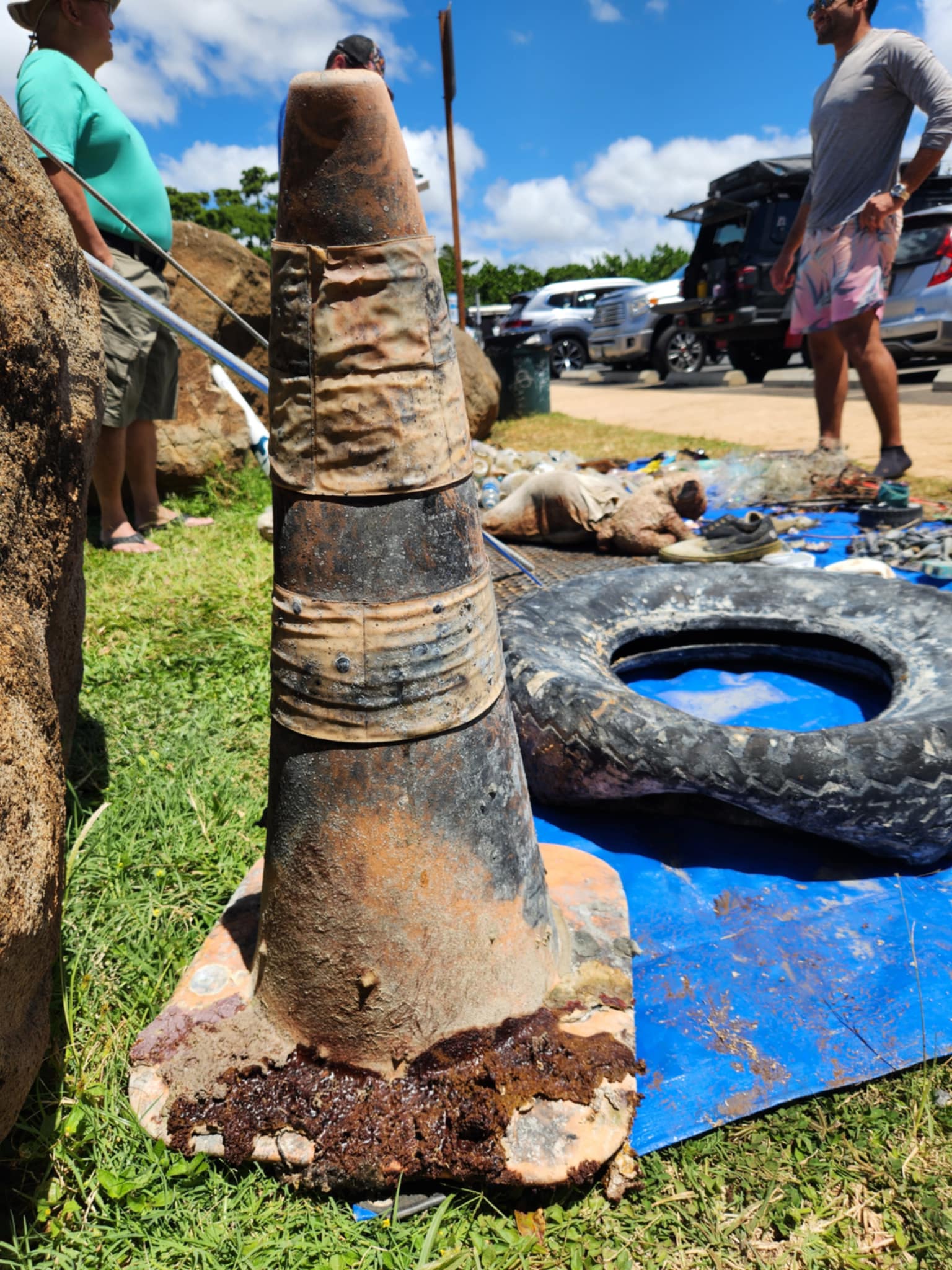traffic cone and tire removed from the ocean