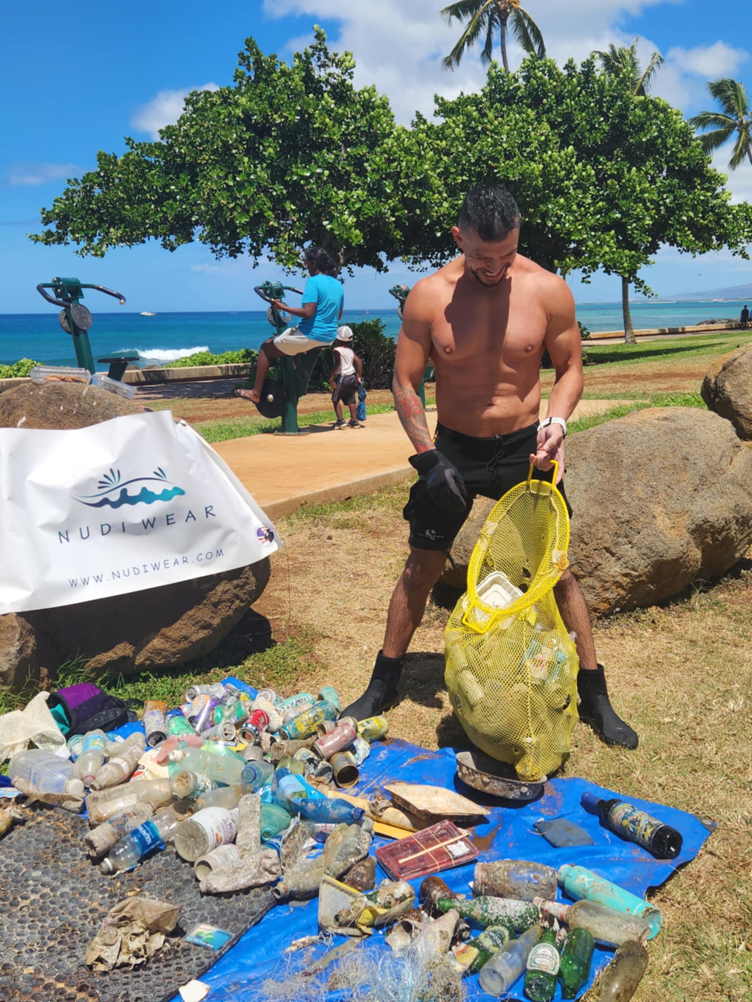 Volunteer emptying a bag full of marine debris removed from the ocean